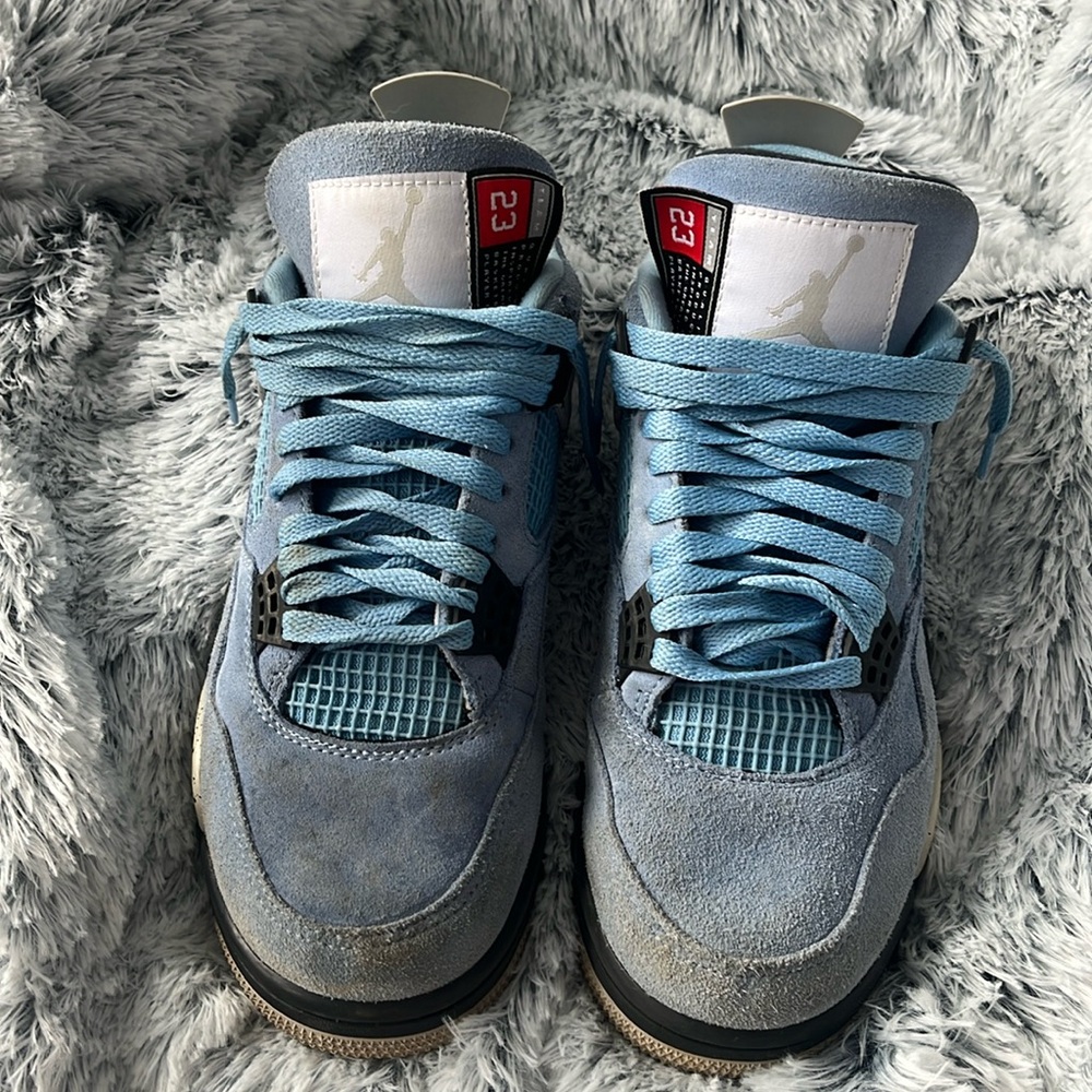 Used Carolina Blue/Black Air Jordan 4 Retro Basketball Shoes. Men’s size 8